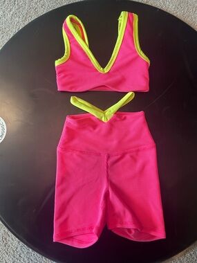 Five Neon Pink Ribbed Two-Piece Set with yellow Trim